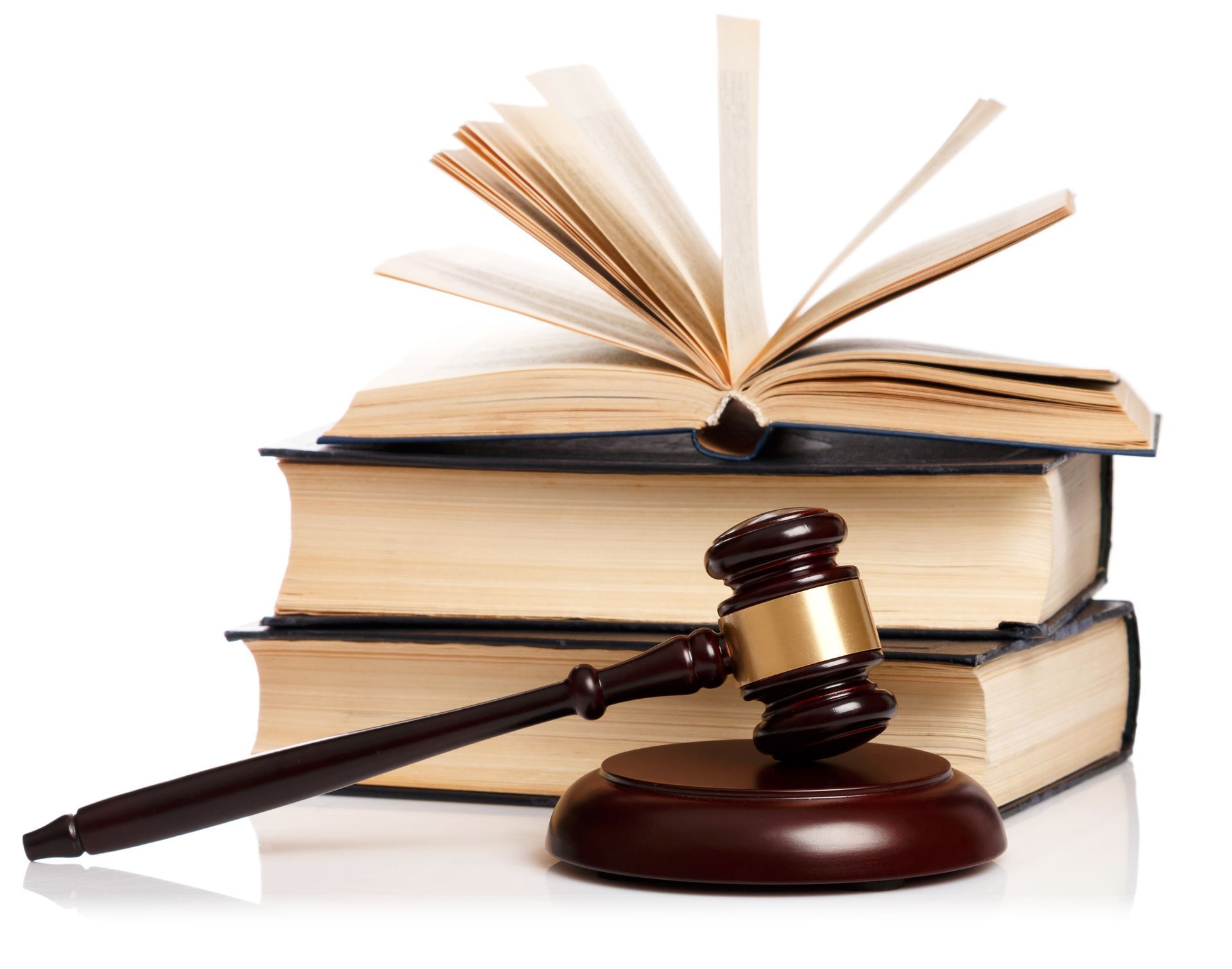Books stacked with gavel, open book on top.