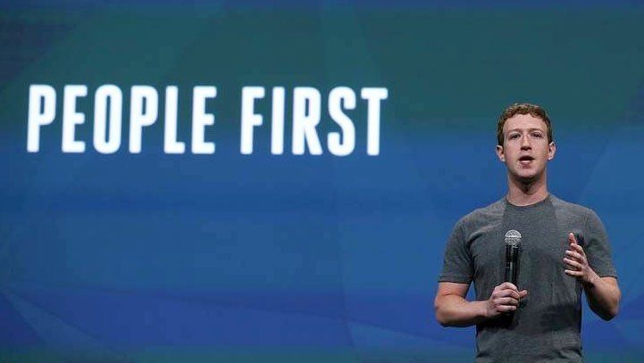 Mark Zuckerberg speaking at a podium with