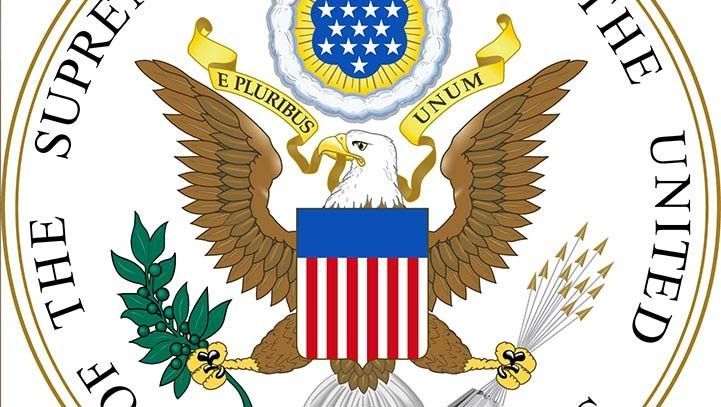 Seal of the Supreme Court: Eagle with shield, wings spread, holding olive branch and arrows; banner reads
