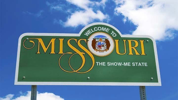 Welcome to Missouri state sign with blue sky background.