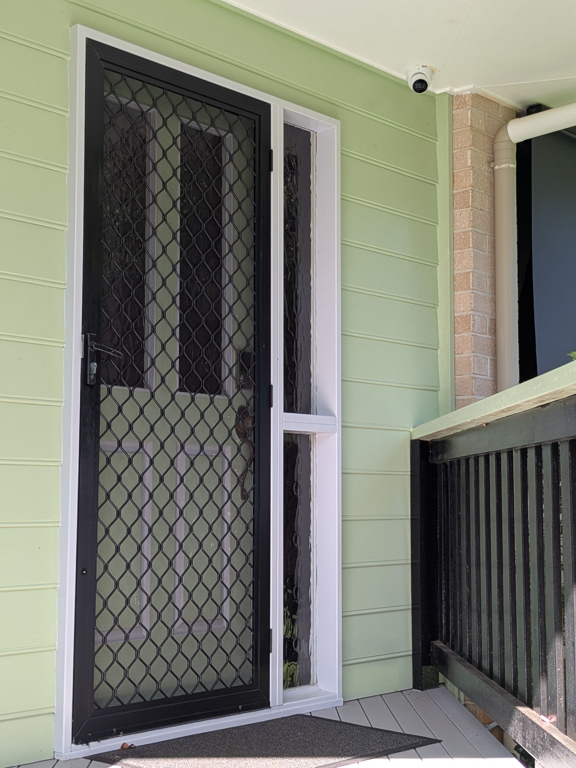A Black Door With a Security Camera on the Ceiling — Direct Connect Services In Woombye, QLD