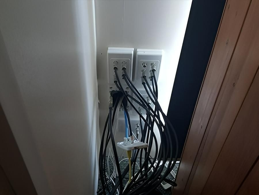 A Bunch of Wires Are Hanging From a Wall — Direct Connect Services In Woombye, QLD