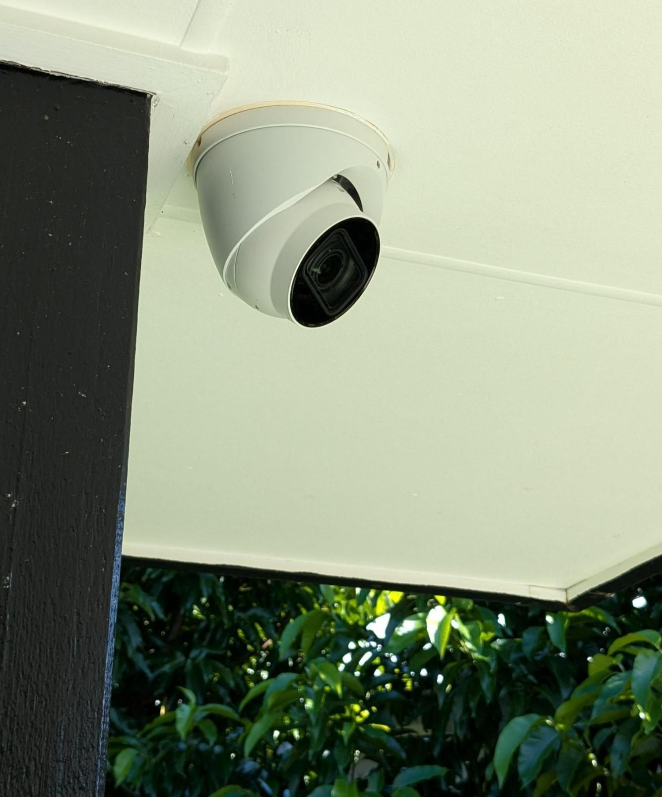 A Security Camera is Mounted on the Ceiling of a House— Direct Connect Services In Woombye, QLD