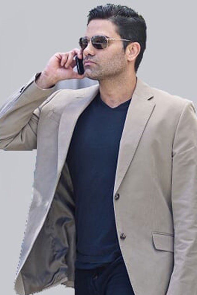 Man Using His Phone — Philadelphia, PA — Carmine's Hair Studio