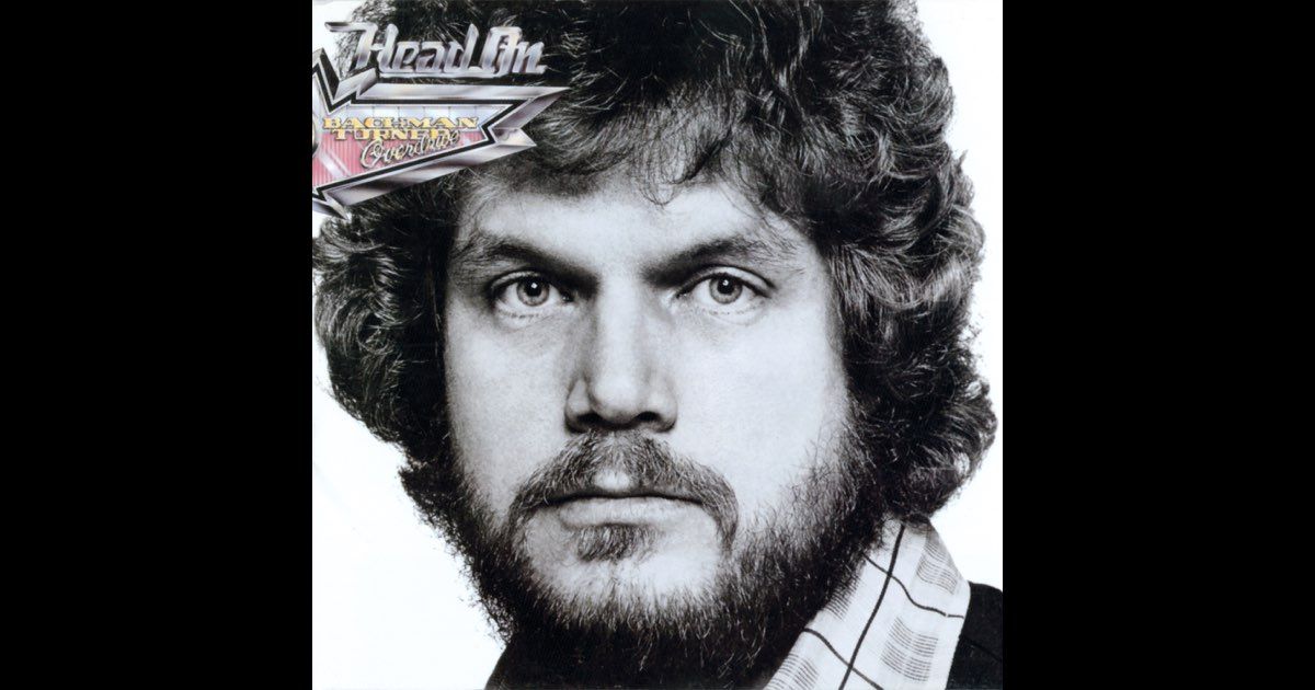 Black and white album cover featuring a close-up portrait of a man with a beard and curly hair.