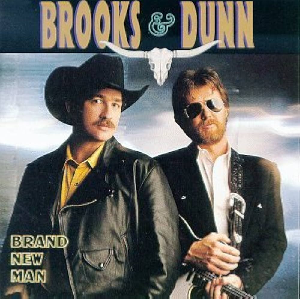 Brooks & Dunn album cover: Two men in cowboy hats and jackets pose, with a guitar, against a sky backdrop. The album title is