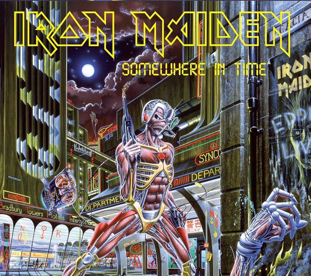 Iron Maiden album cover: Cyborg Eddie stands in a futuristic city with neon lights, holding a weapon.