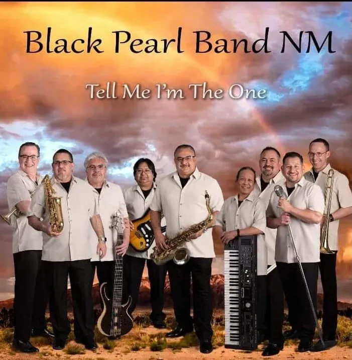 Black Pearl Band NM album cover. Ten musicians in white shirts stand against a colorful sunset backdrop. They hold instruments, smiling.