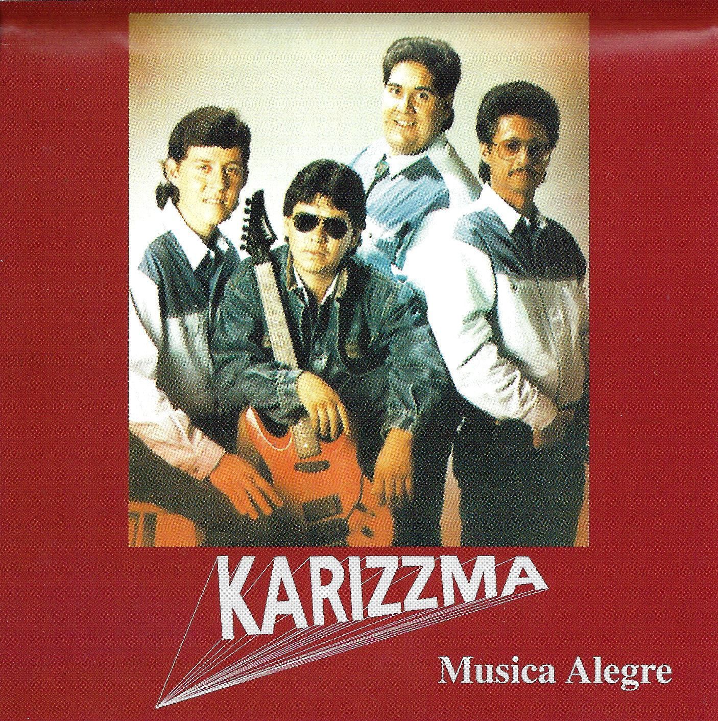Karizzma music band, five young men posing; red background.