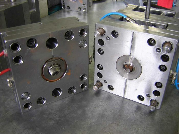 Photo of a single-cavity mold for a two-piece dosing cap.