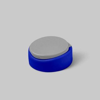 Photo of a designer round-shaped flip-top cap.