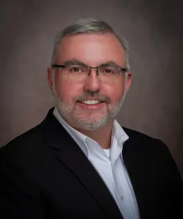Fiduciary Paul Boggs in a suit and tie.