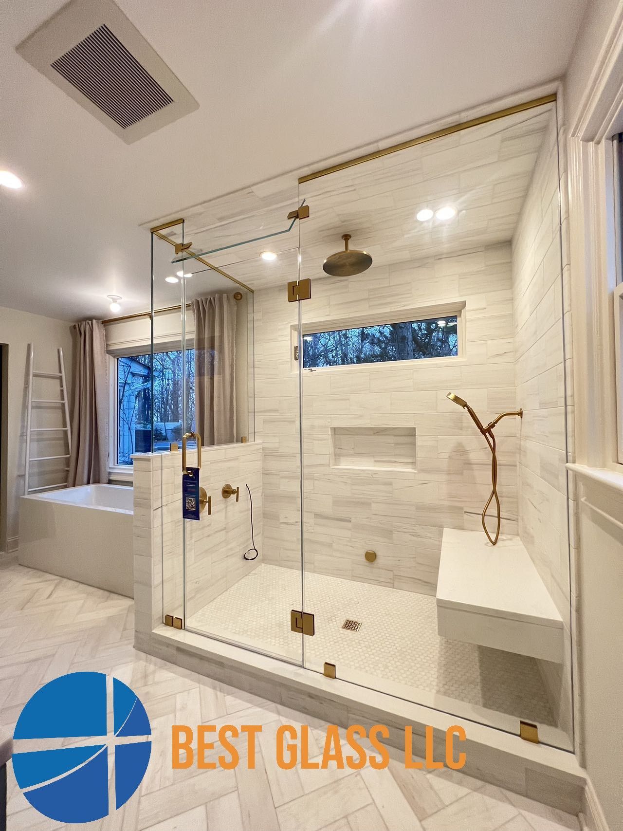 A bathroom with a walk in shower and a bathtub.
