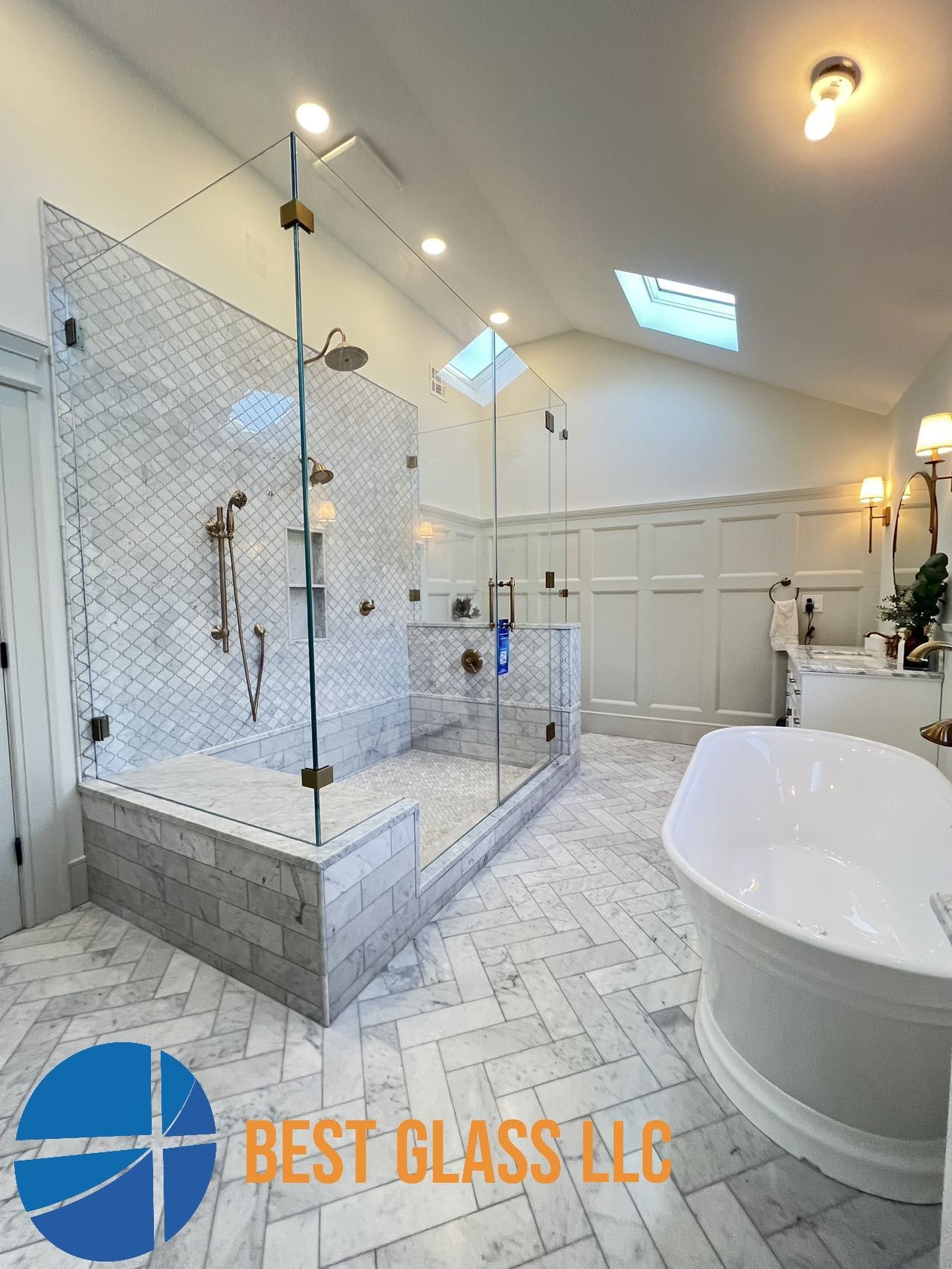 A bathroom with a walk in shower and a bathtub.