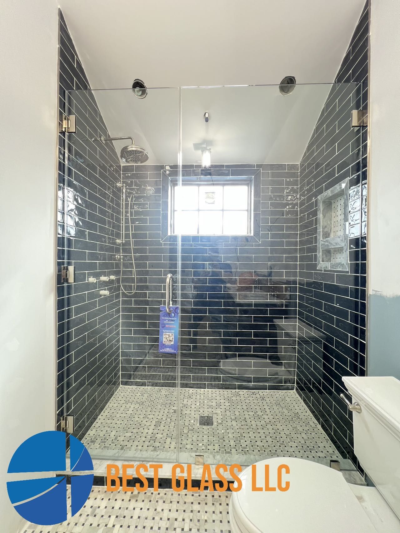 A bathroom with a walk in shower and a toilet