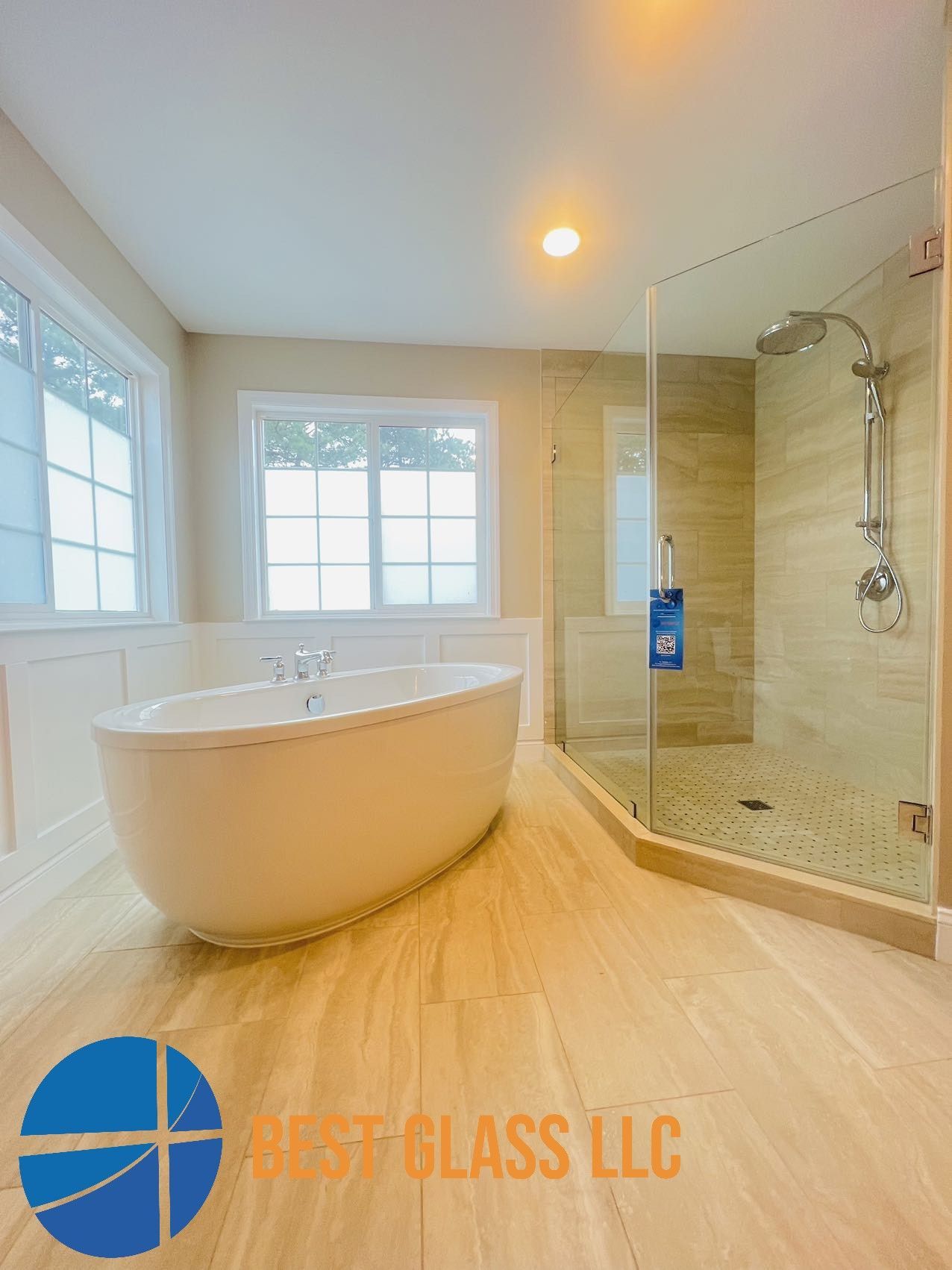 A bathroom with a tub and a walk in shower.