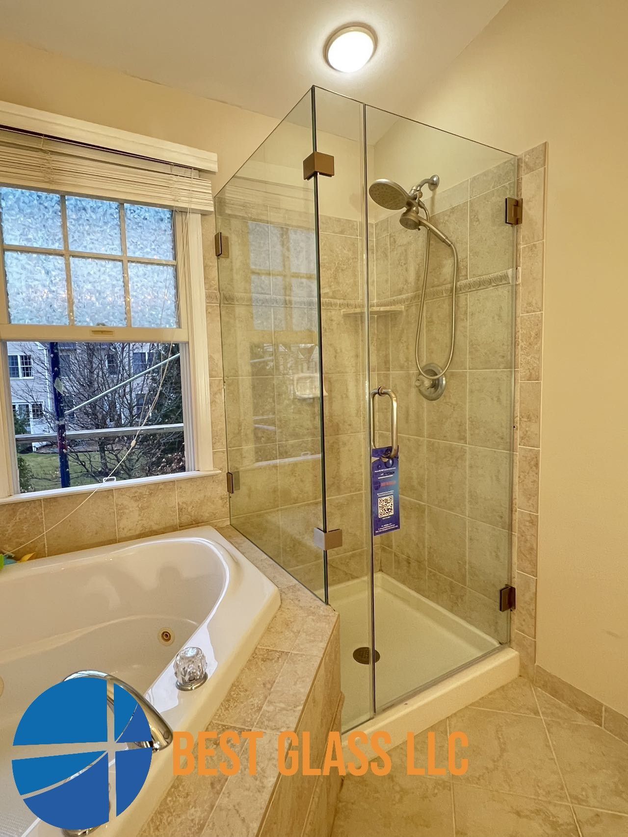 A bathroom with a tub , shower , and window.