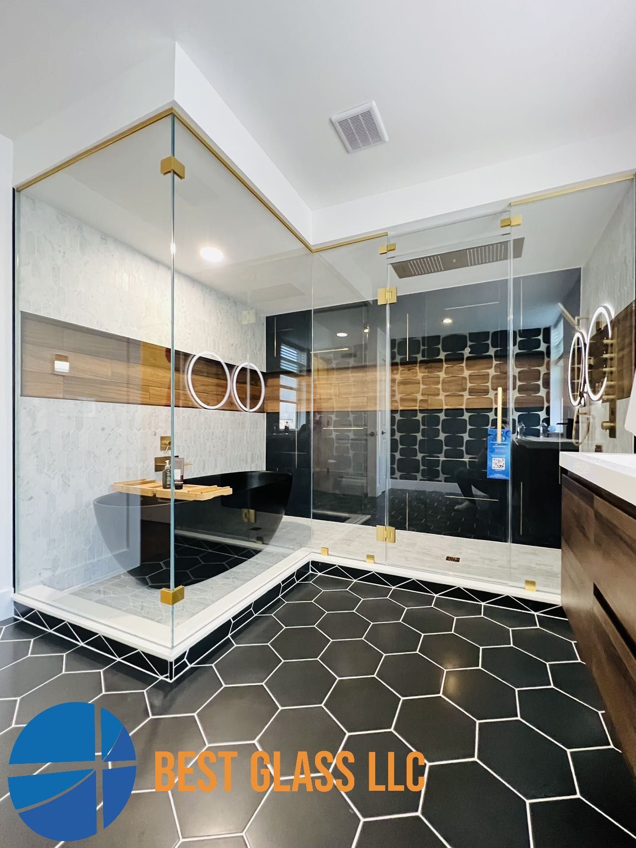 A bathroom with a walk in shower and a bathtub.