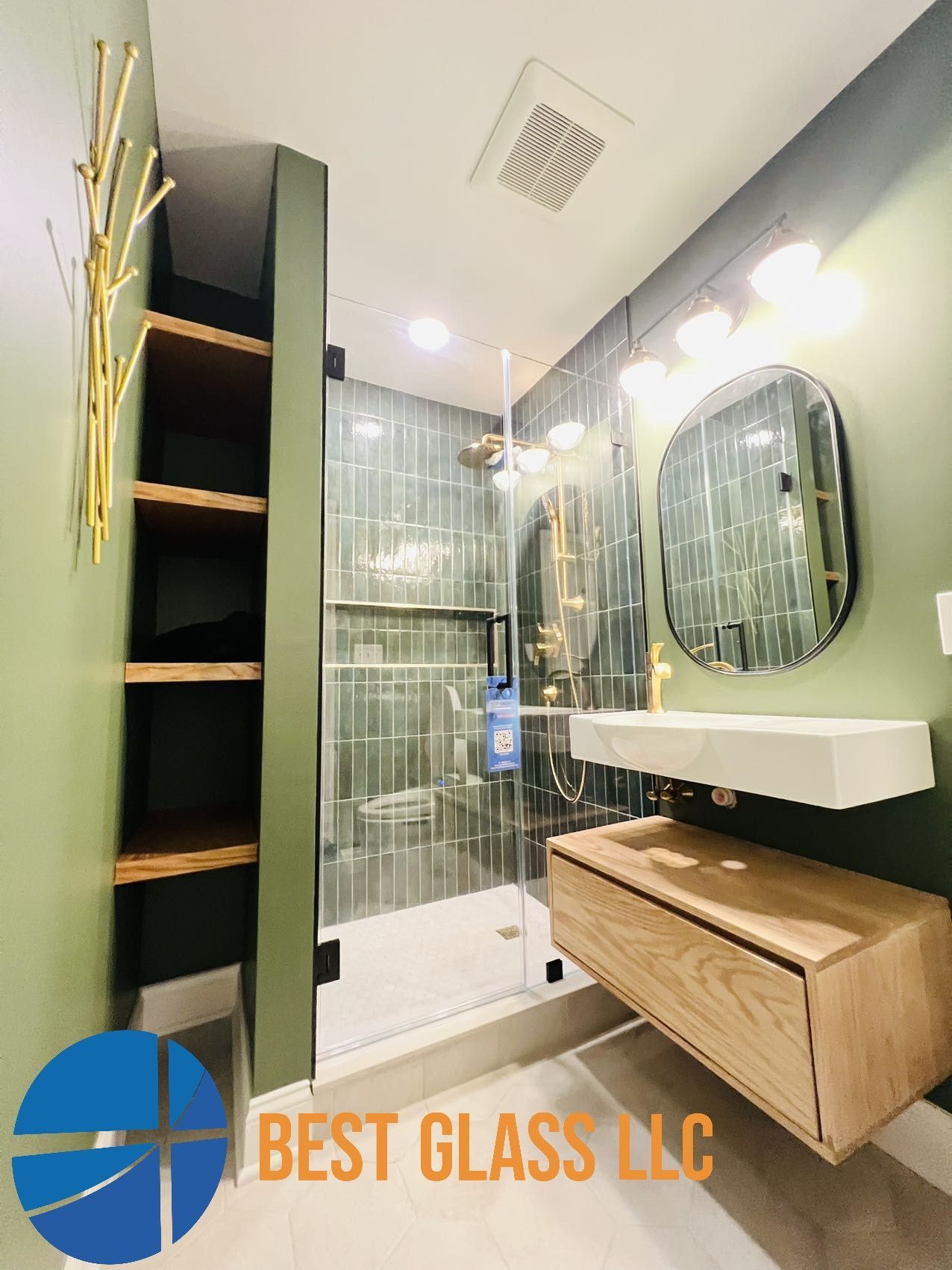 A bathroom with a sink , mirror , and shower.