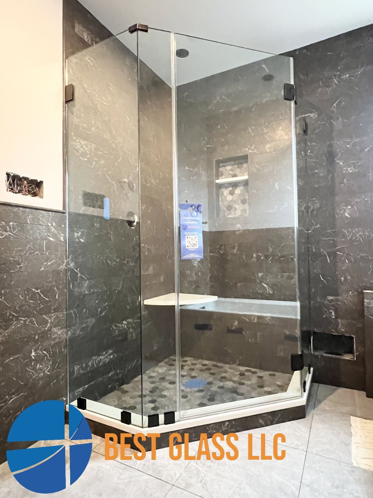 A bathroom with a walk in shower and a bathtub.