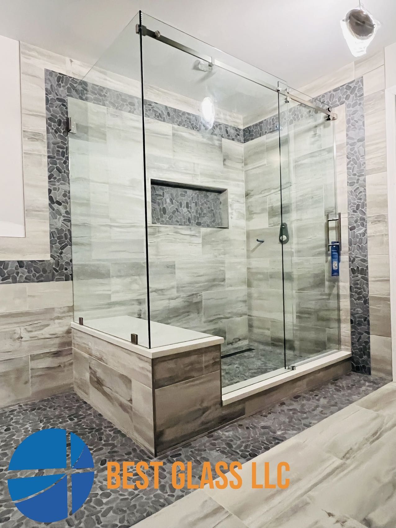 A bathroom with a walk in shower and a bathtub.