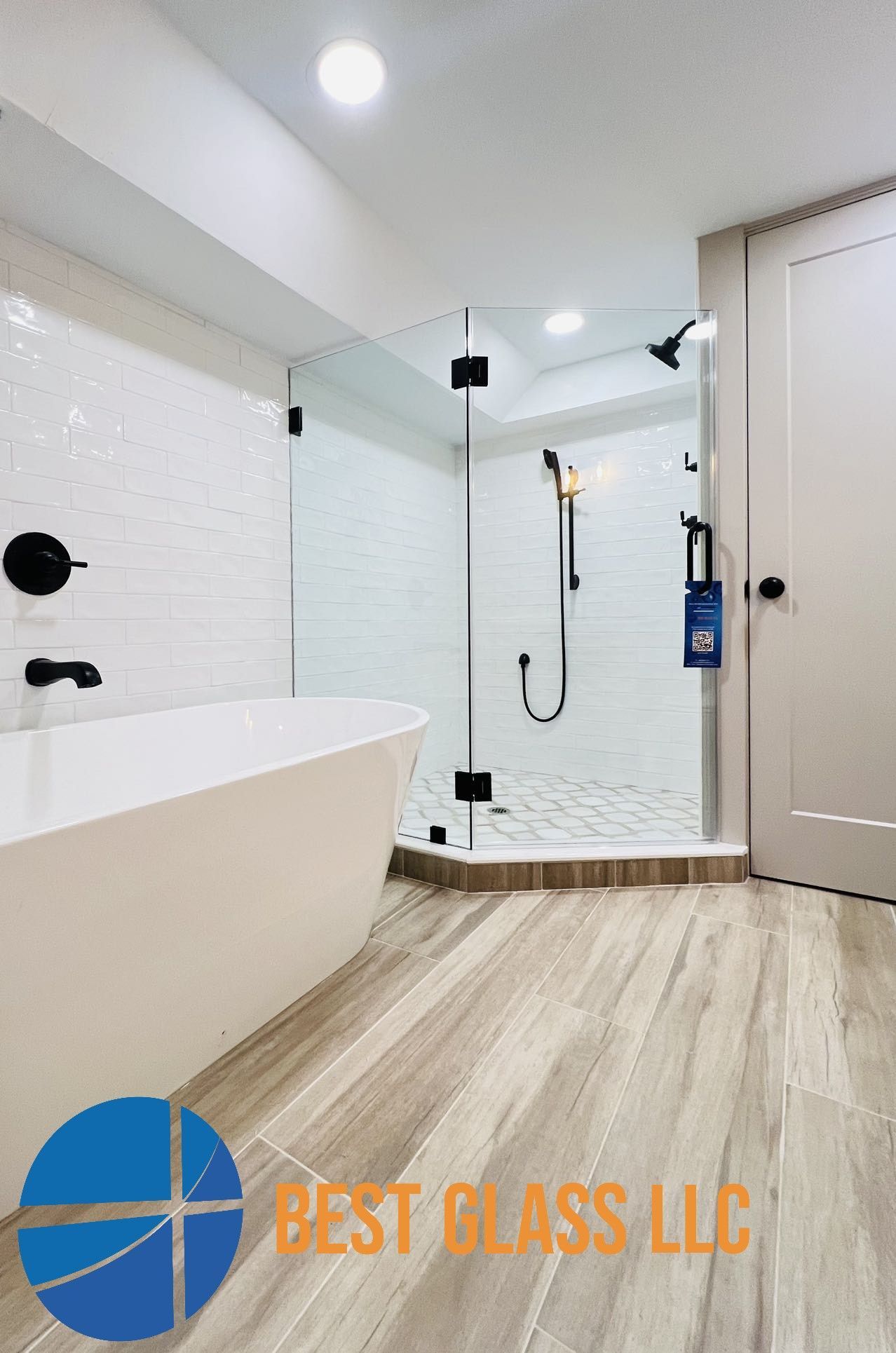 A bathroom with a bathtub and a walk in shower.