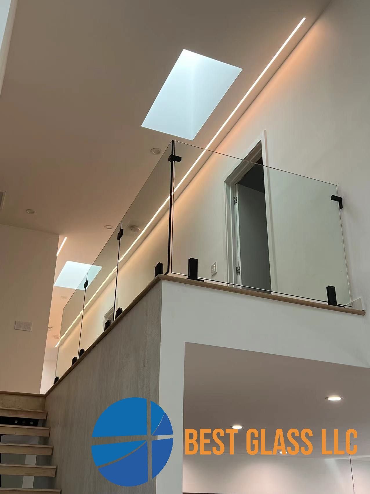 A picture of a staircase taken by best glass llc