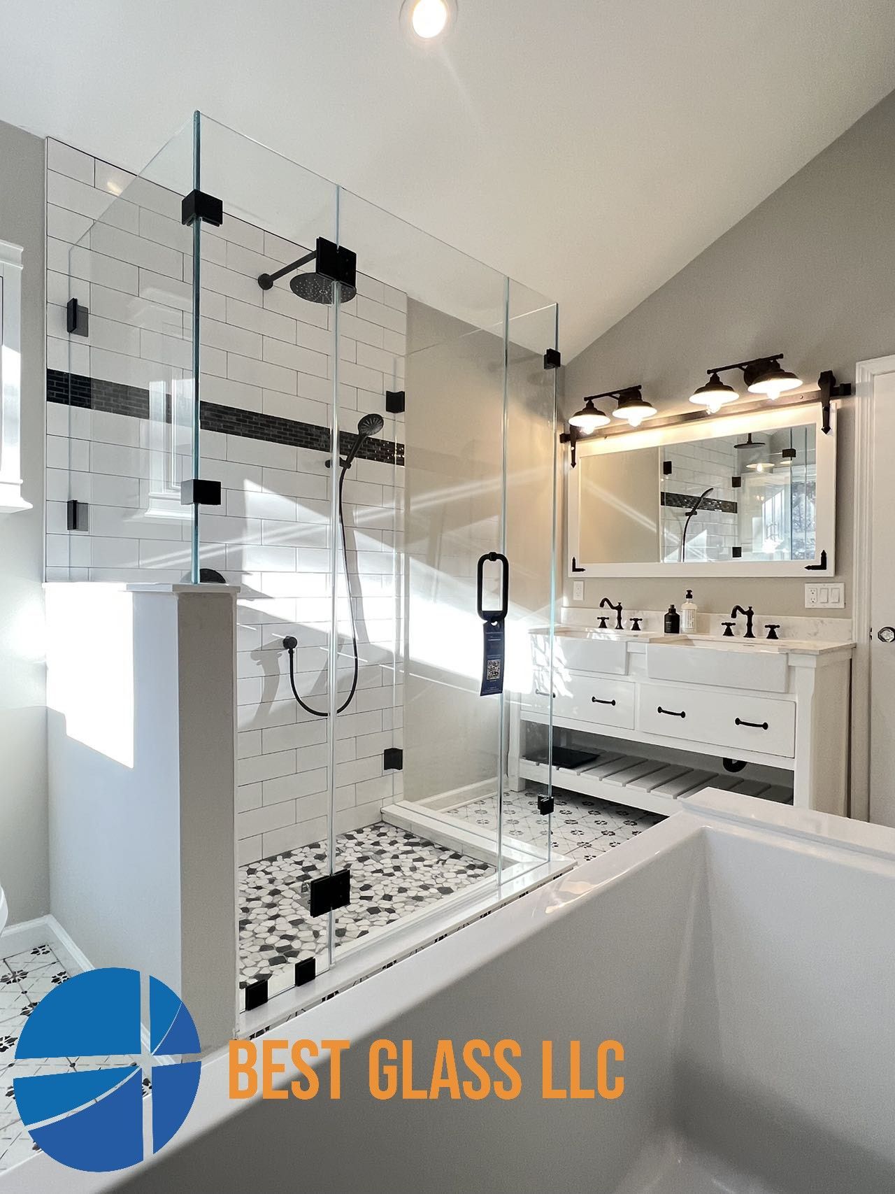 A bathroom with a walk in shower and a bathtub.