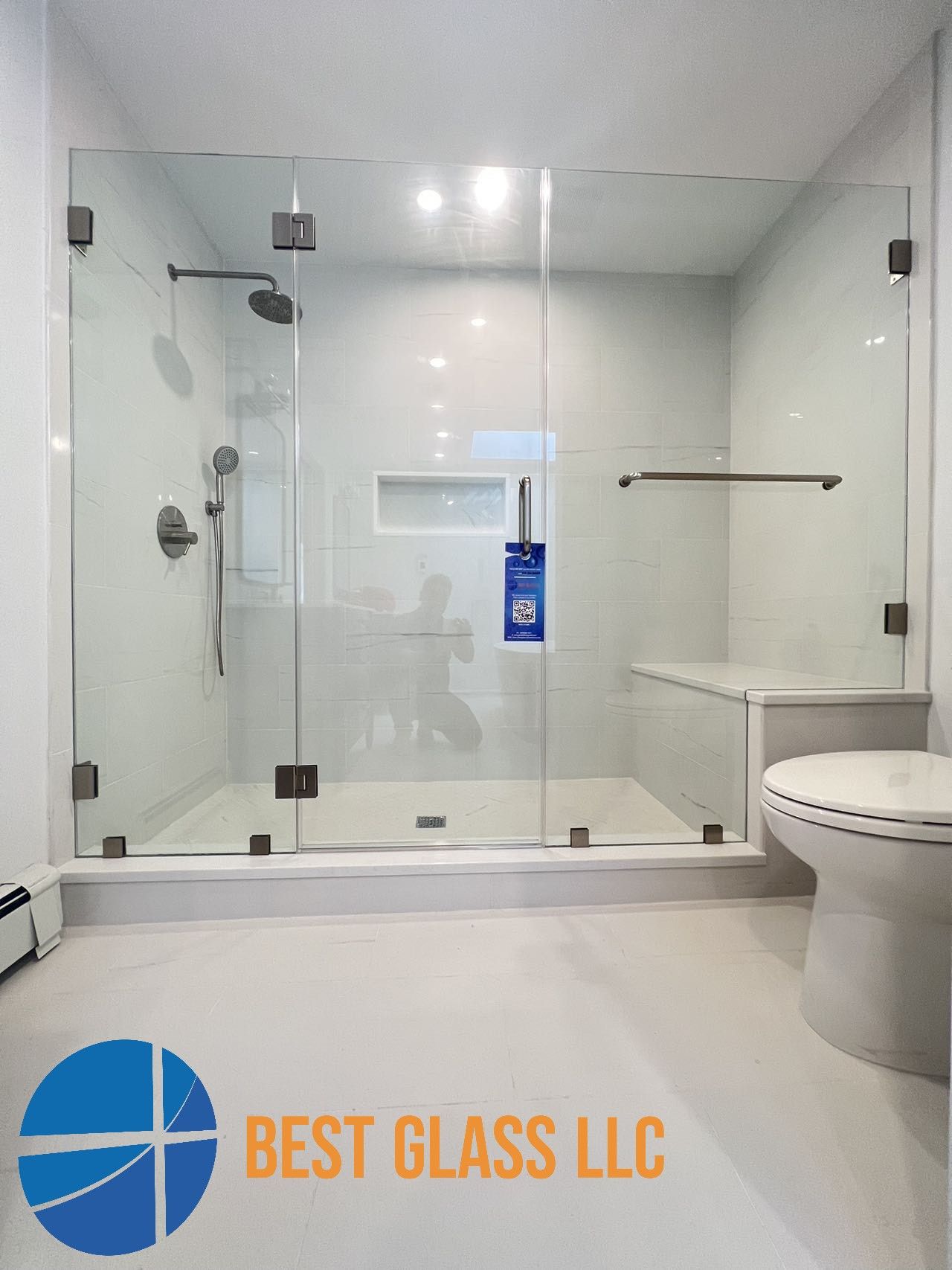 A bathroom with a walk in shower and a toilet.