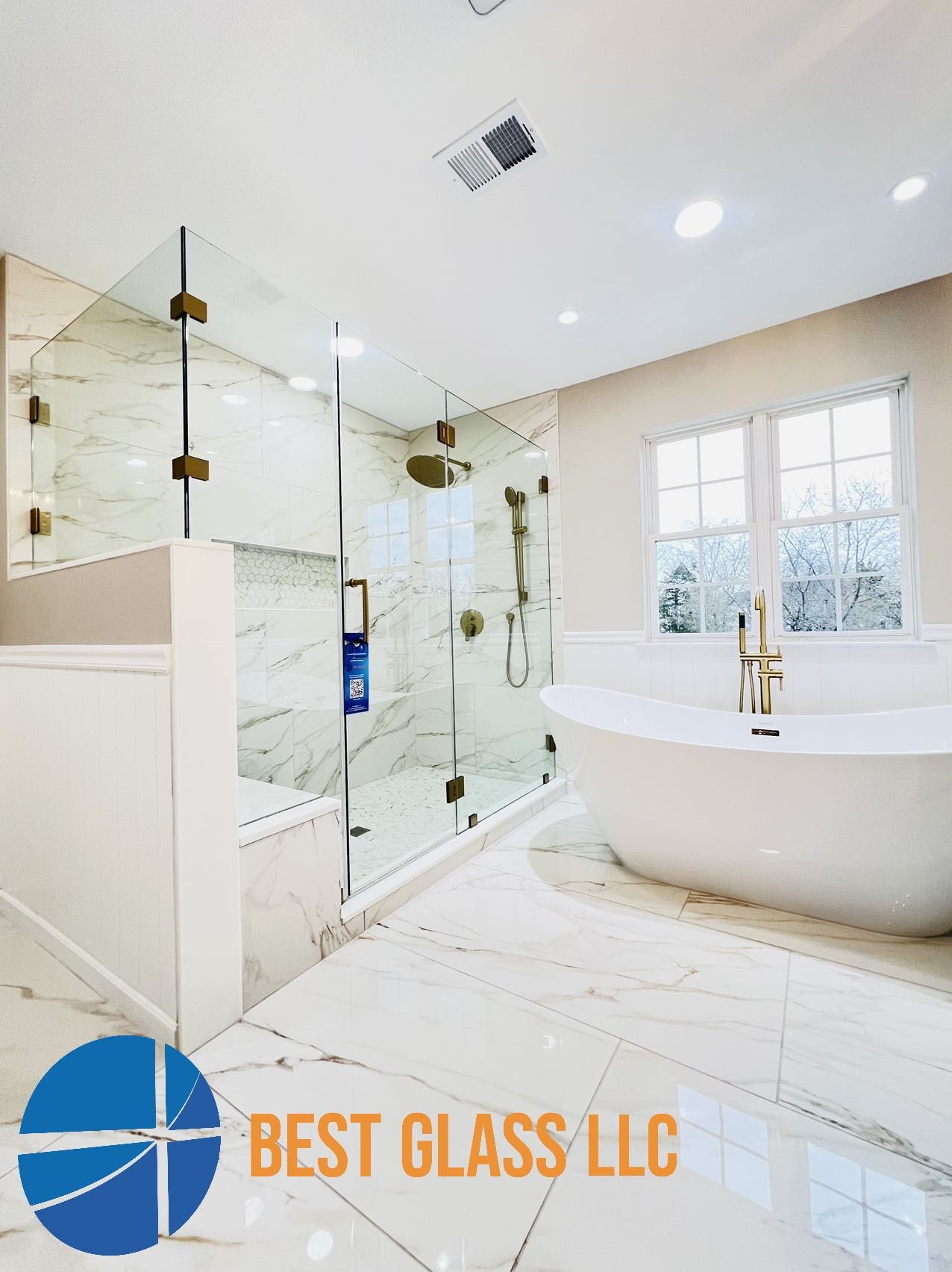 A bathroom with a bathtub , shower , and window.