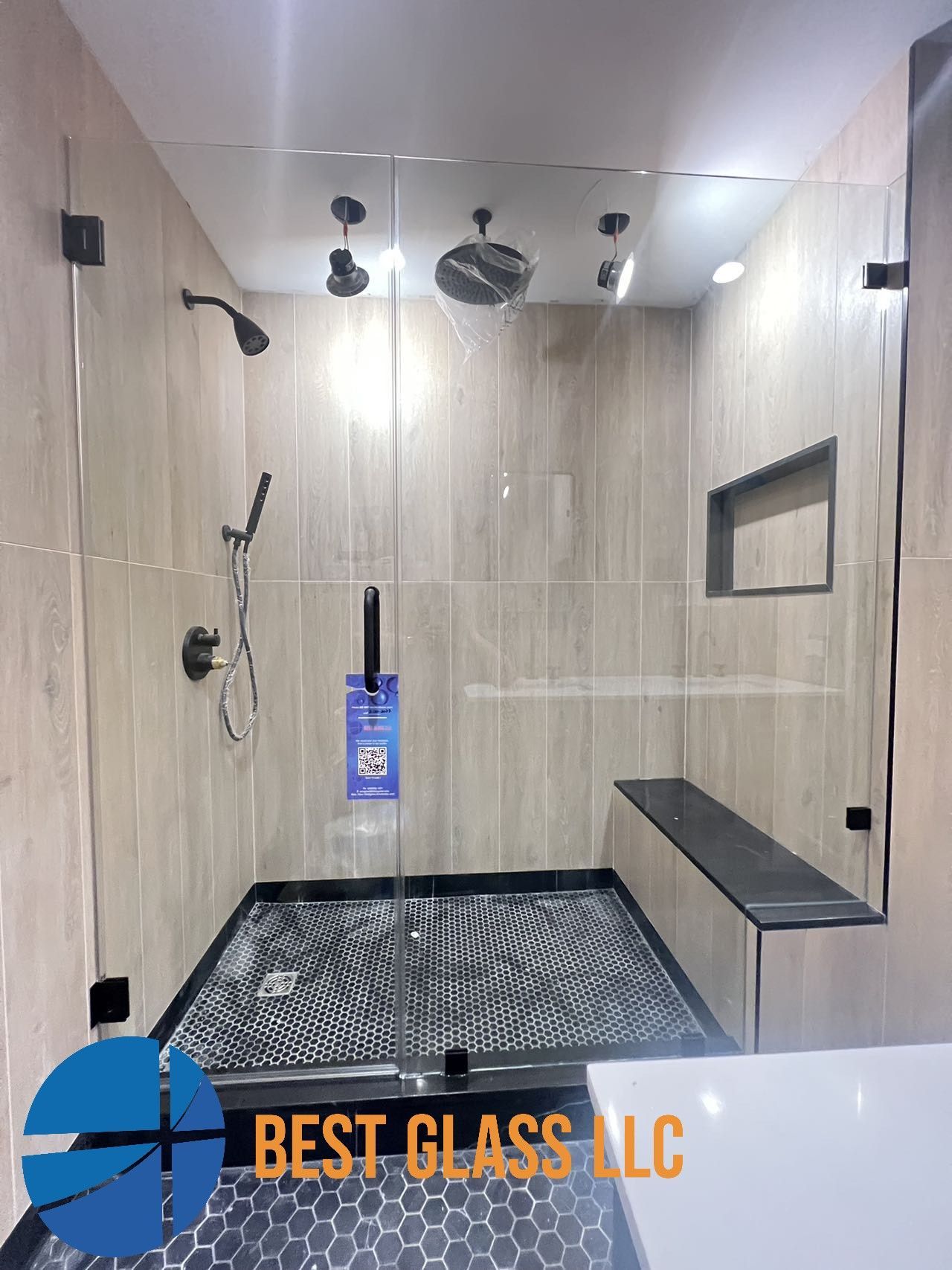 A bathroom with a walk in shower and a bathtub.