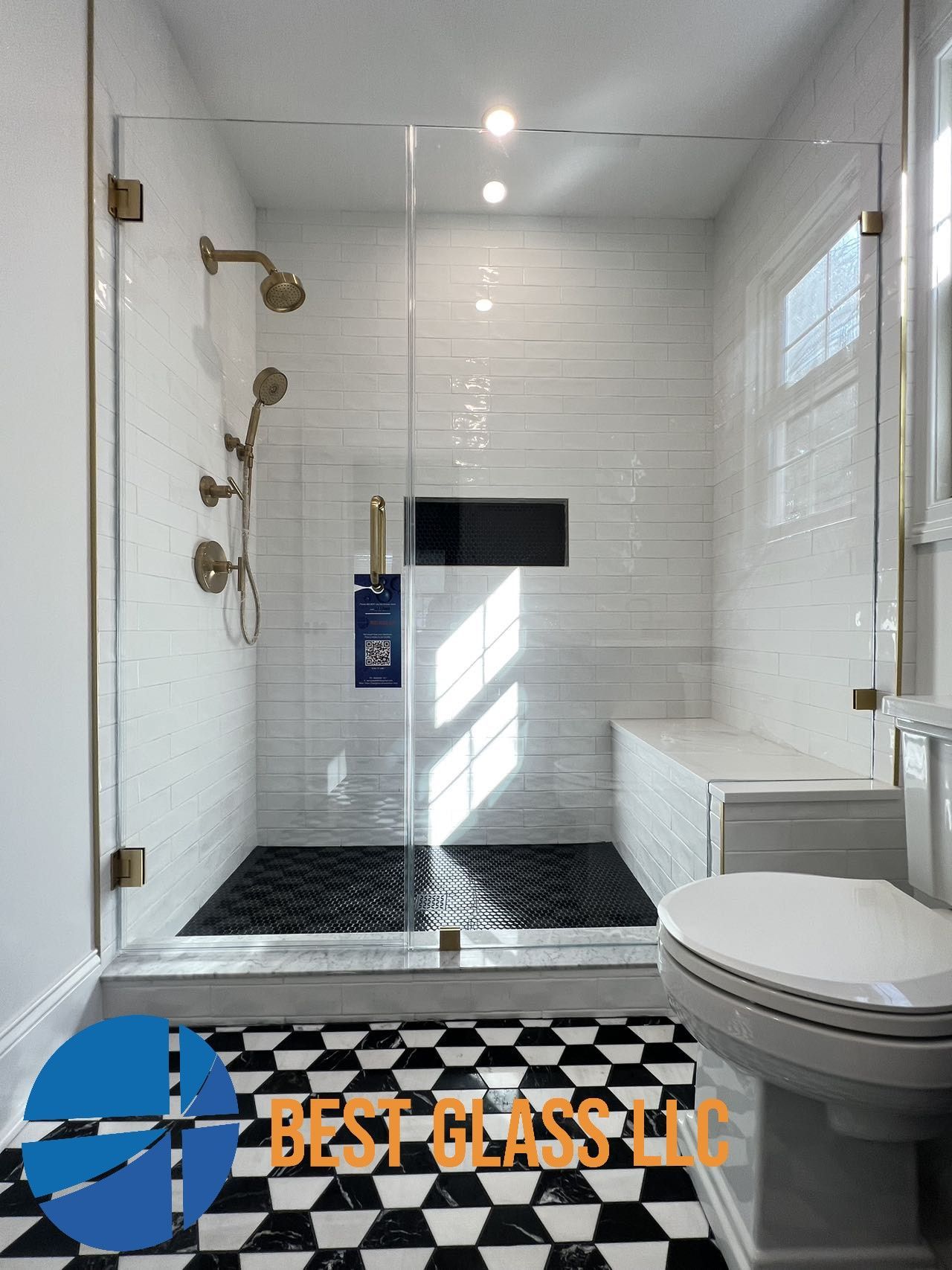 A bathroom with a walk in shower and a toilet.