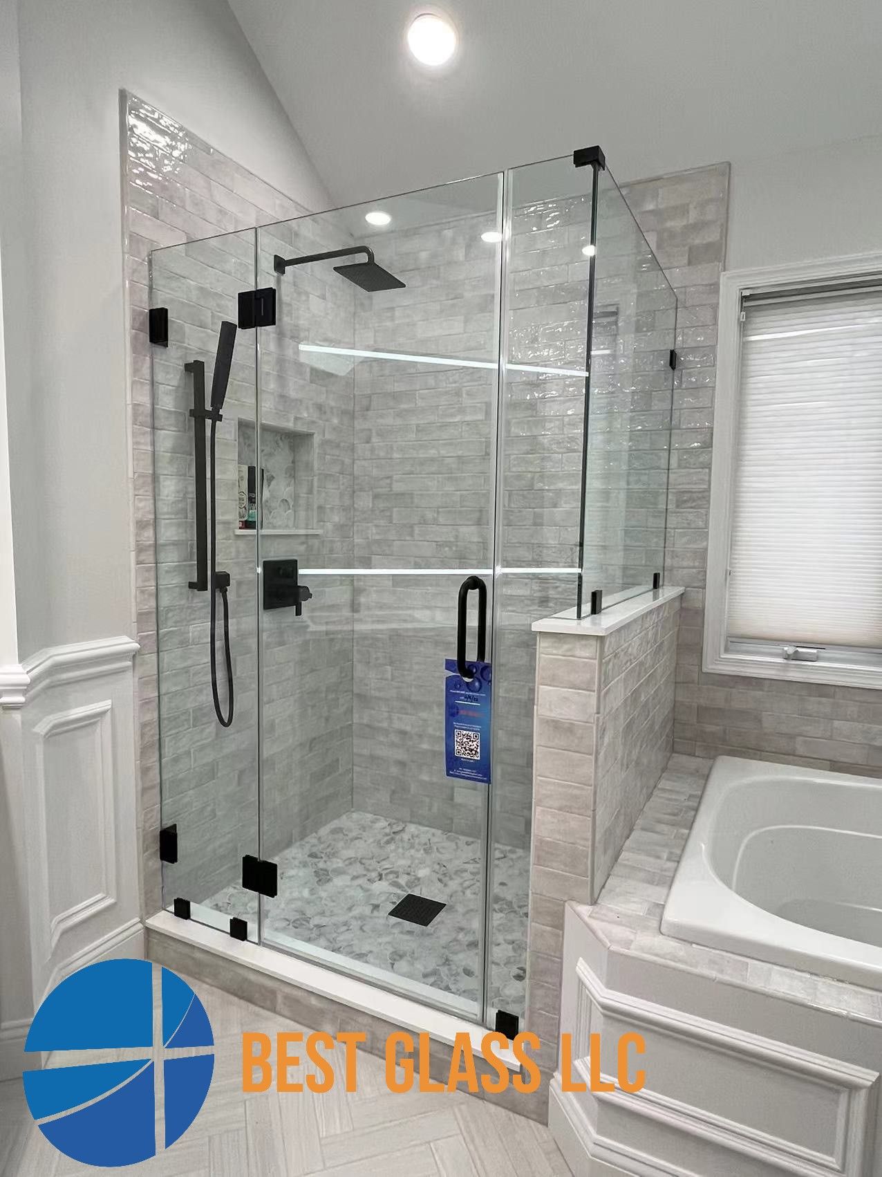 A bathroom with a walk in shower and a bathtub.