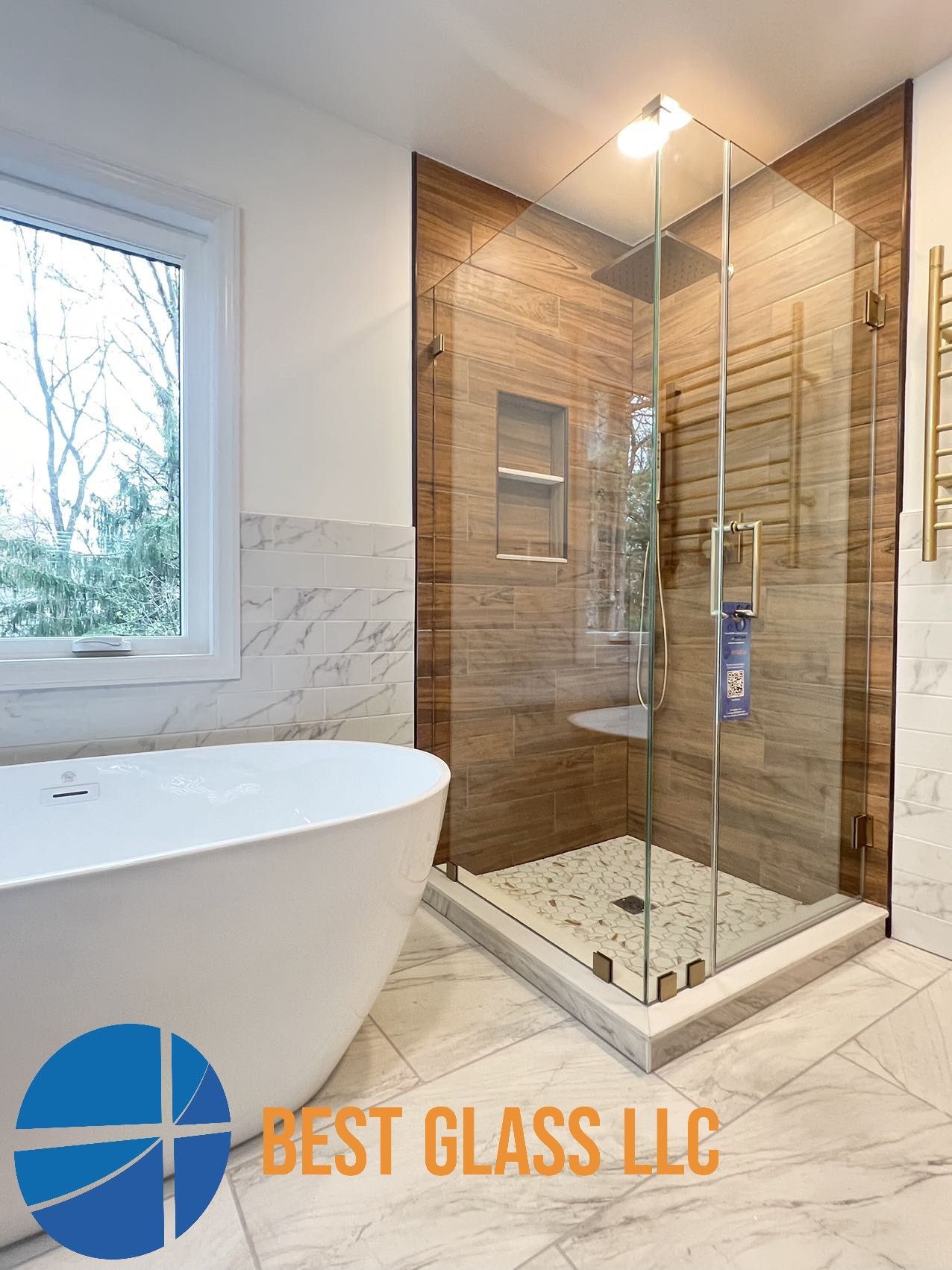 A bathroom with a tub and a walk in shower.