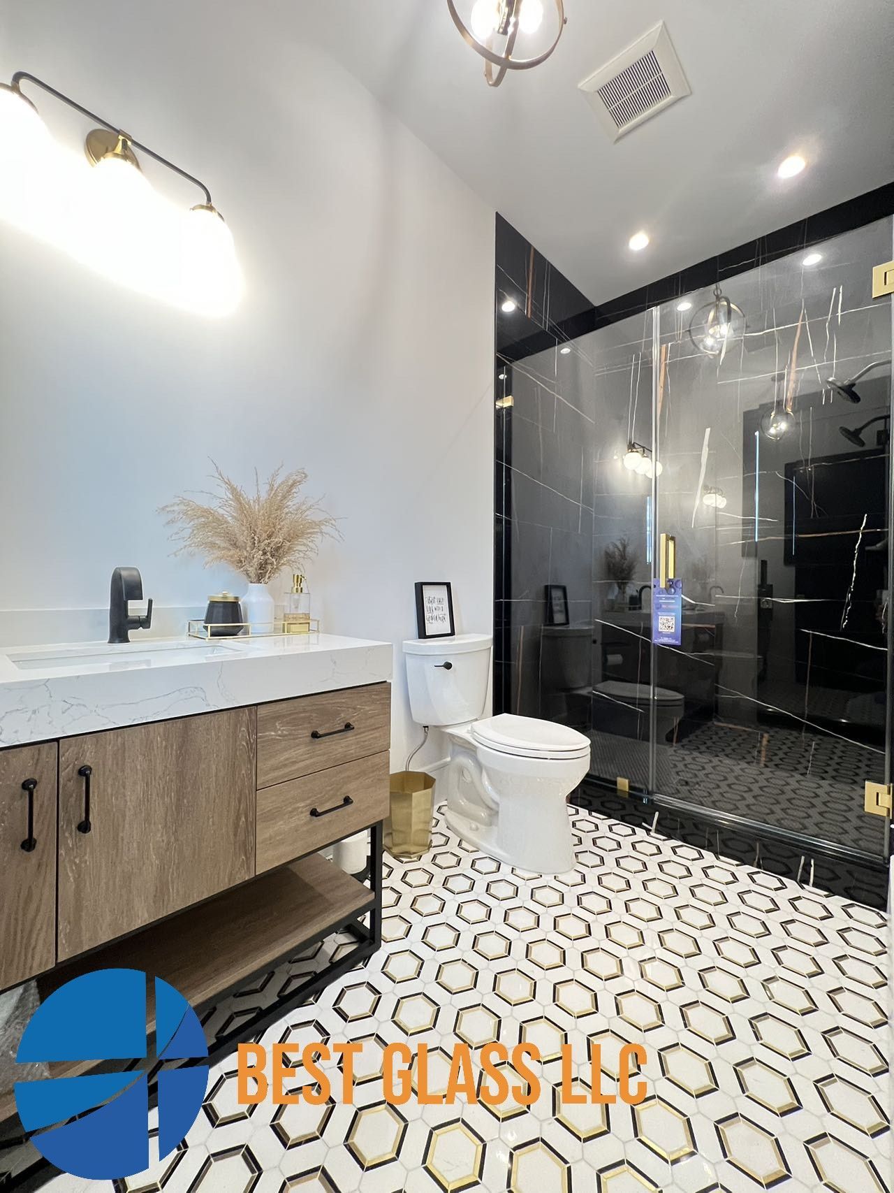 A bathroom with a toilet , sink , and shower.
