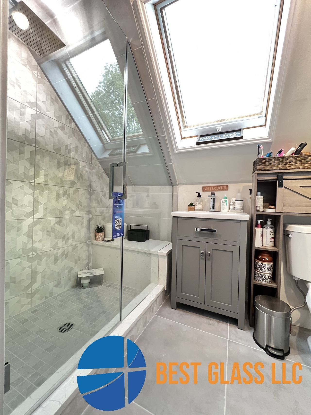 A bathroom with a walk in shower and a skylight from best glass llc