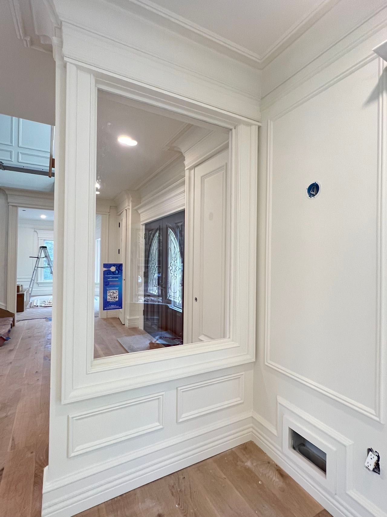 There is a large mirror in the middle of the room.