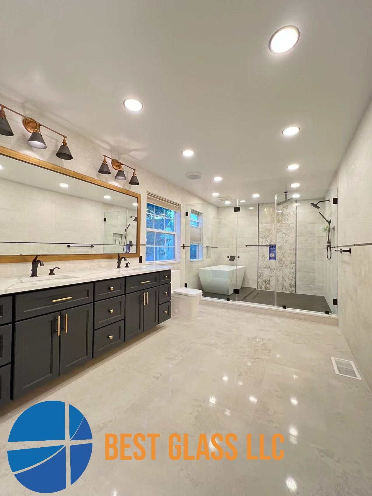 A bathroom with two sinks , a tub , and a walk in shower.