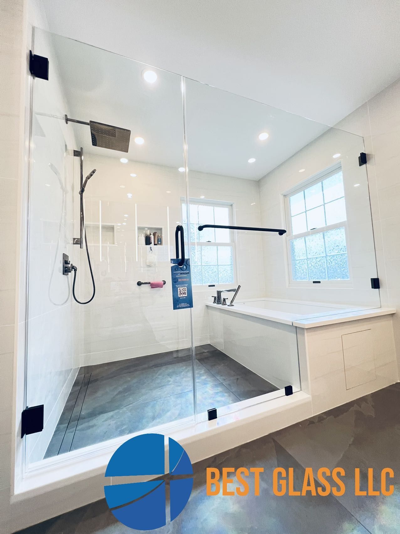 A bathroom with a walk in shower and a bathtub.