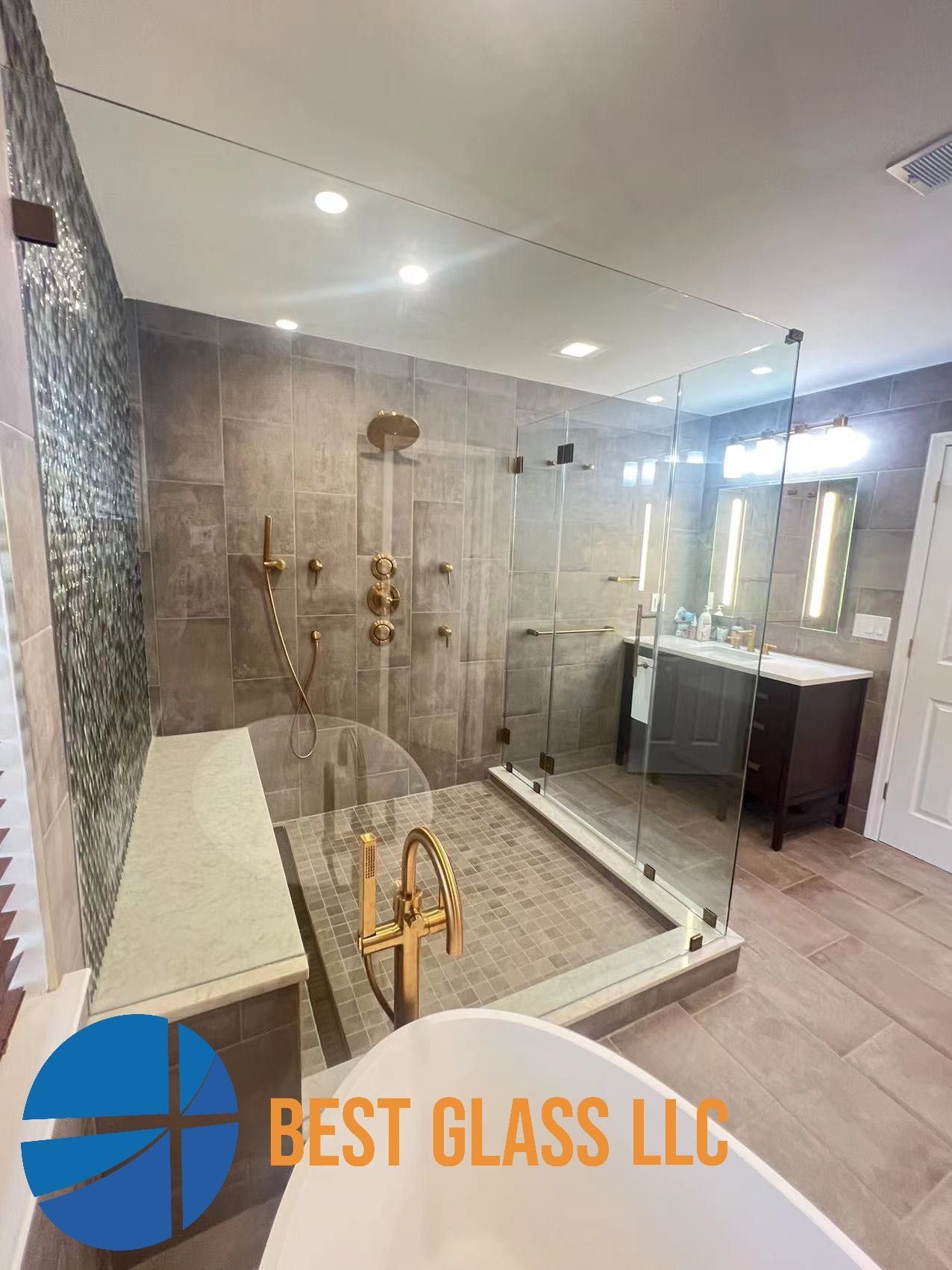 A bathroom with a walk in shower and a bathtub.