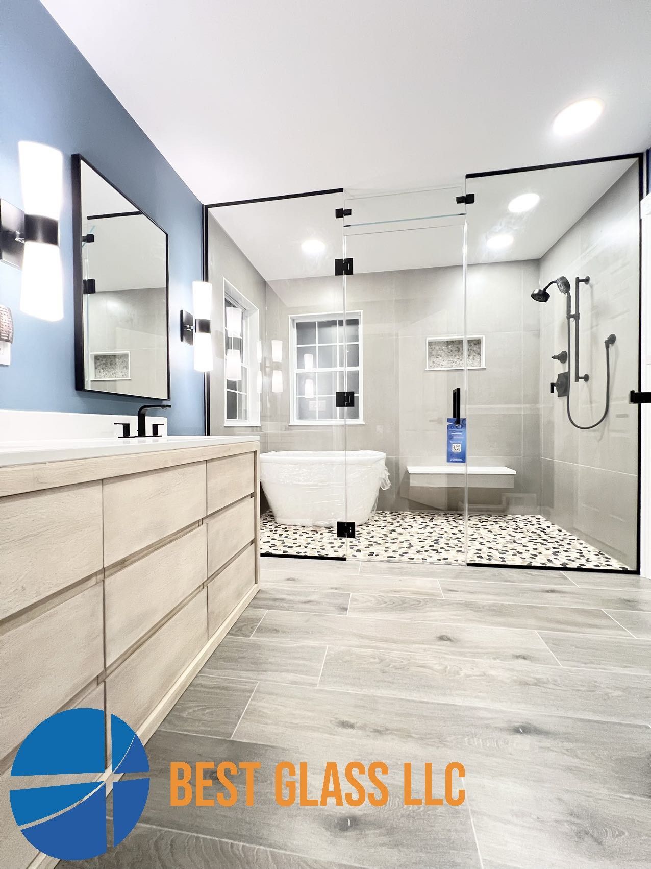 A bathroom with a walk in shower and a bathtub