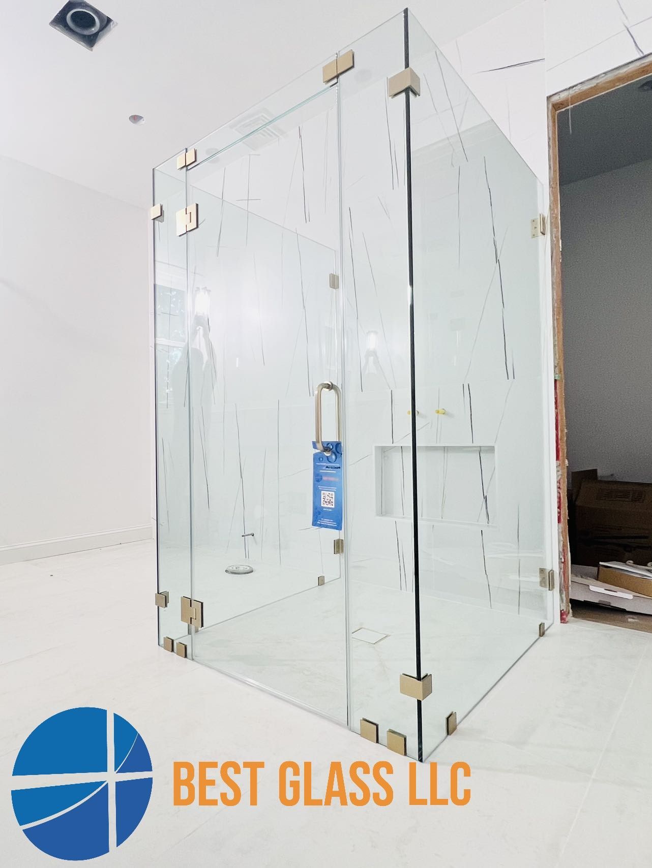 A picture of a shower stall with the words best glass llc on the bottom