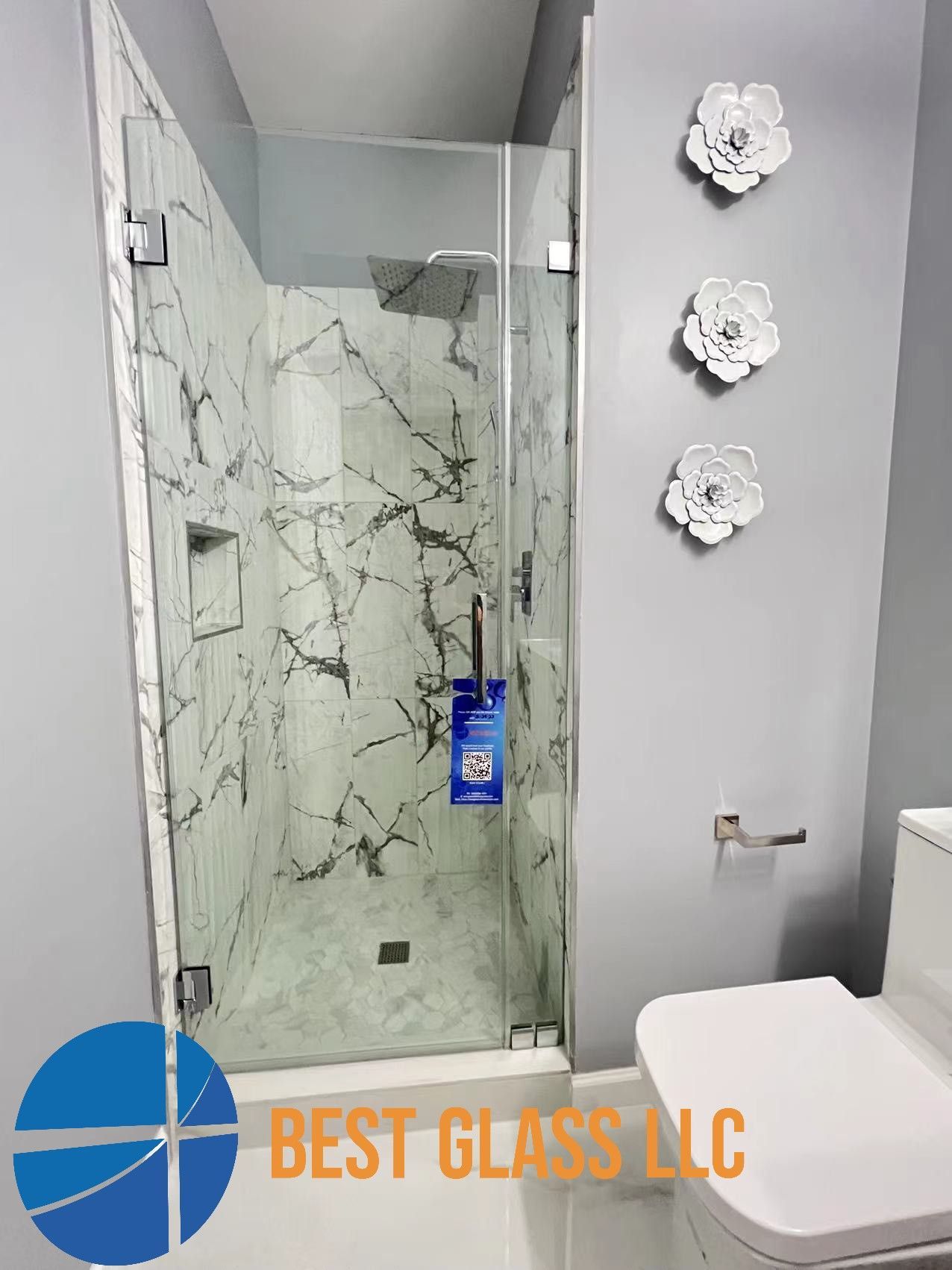 A bathroom with a walk in shower and a toilet