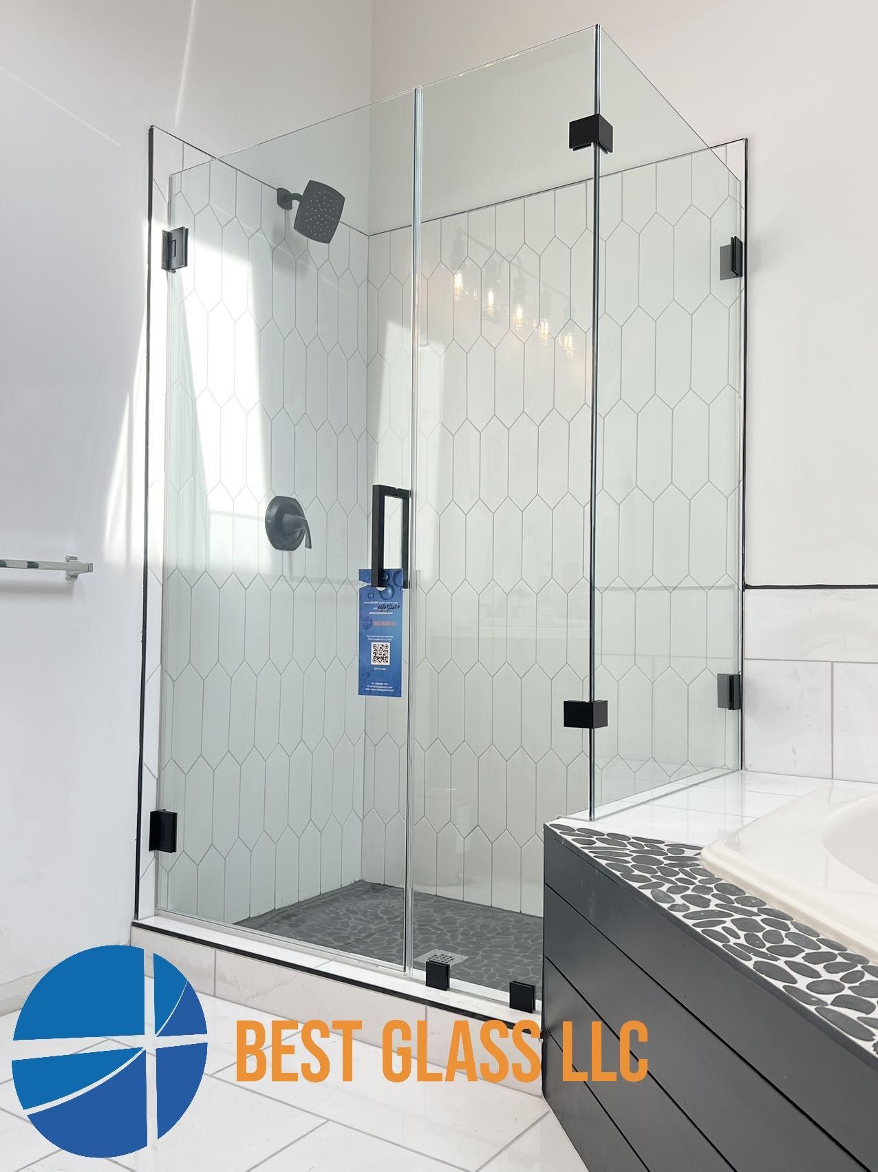 A bathroom with a walk in shower and a bathtub.