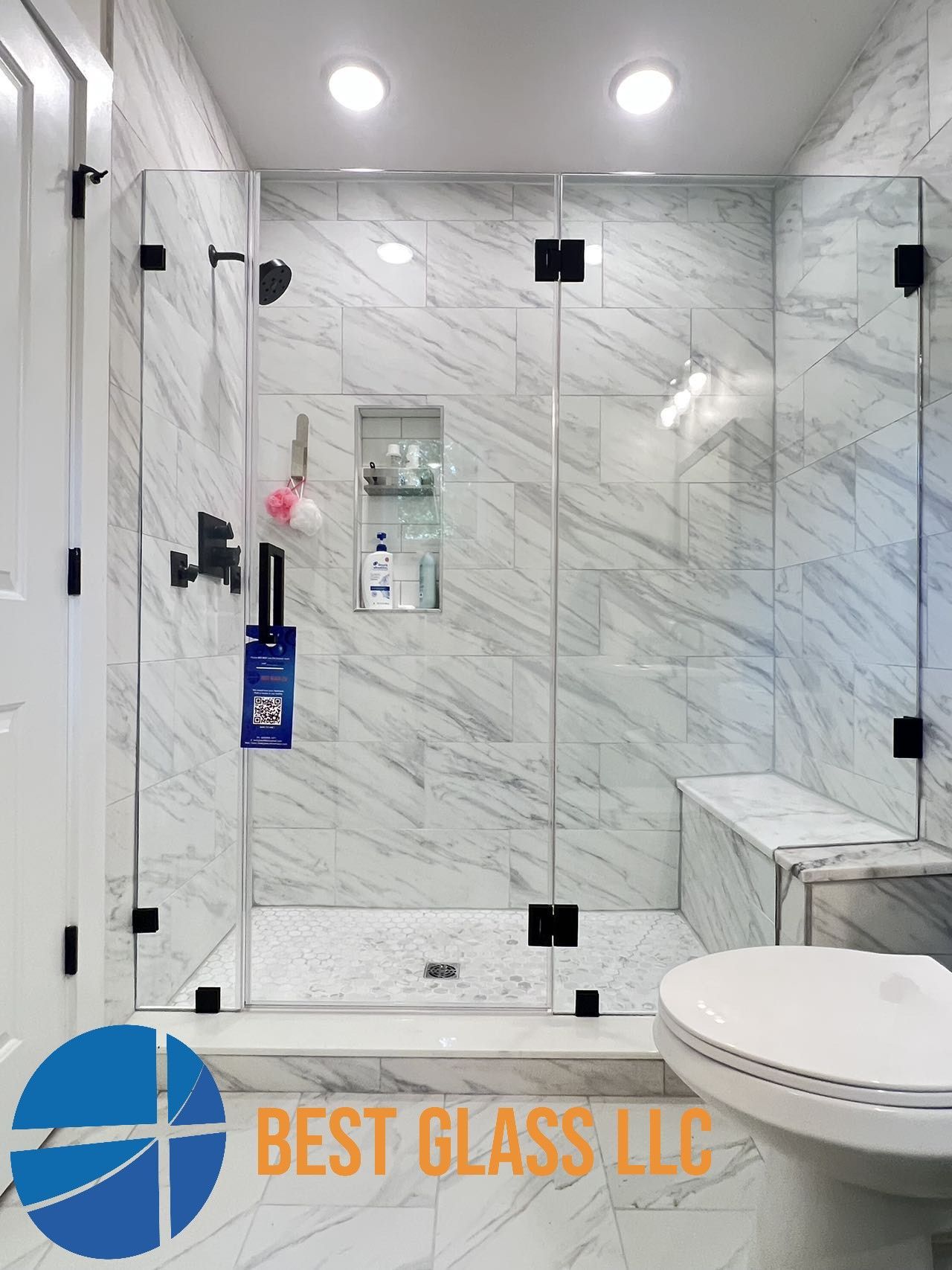 A bathroom with a walk in shower and a toilet.