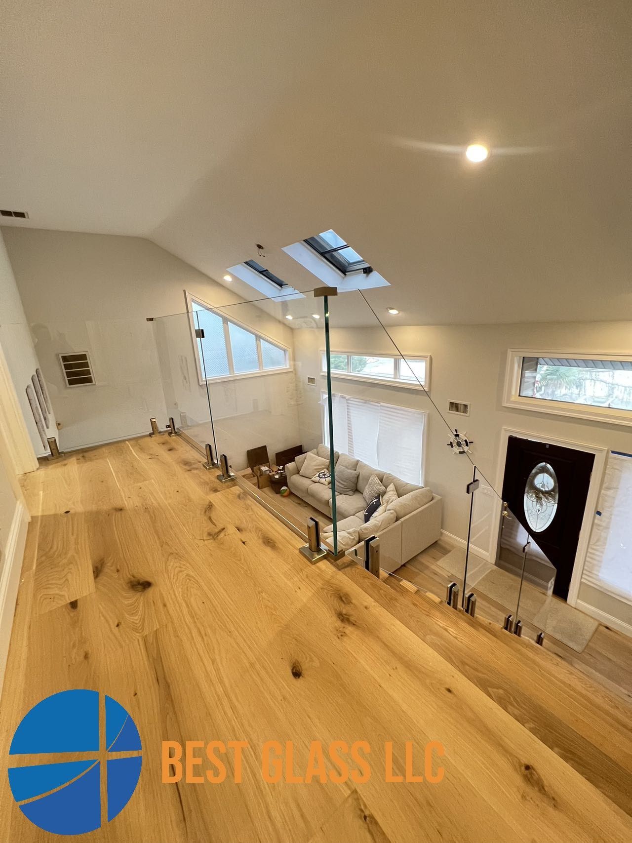 A living room with hardwood floors and a couch.