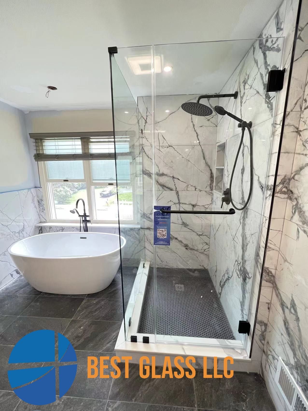 A bathroom with a bathtub and a walk in shower.