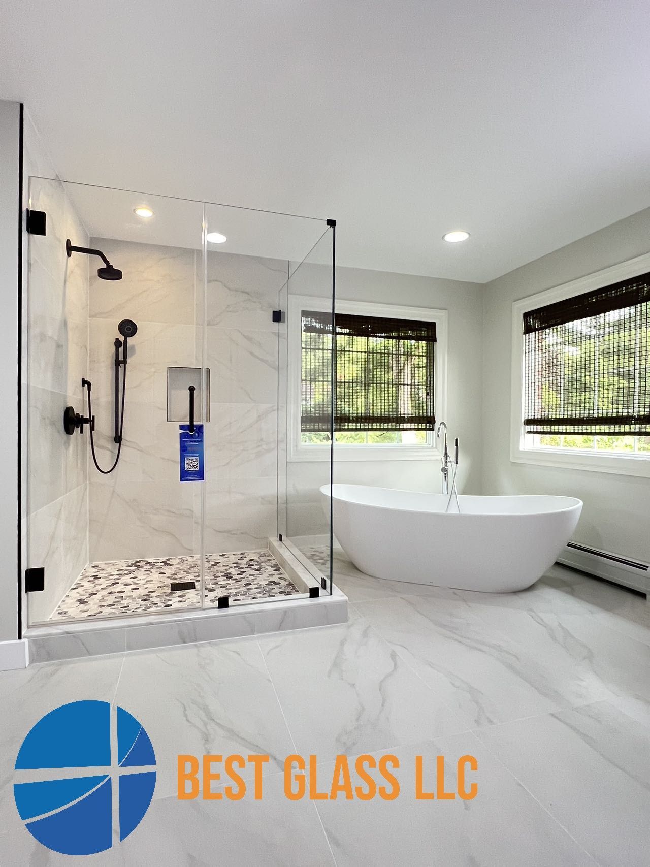 A bathroom with a walk in shower and a bathtub.