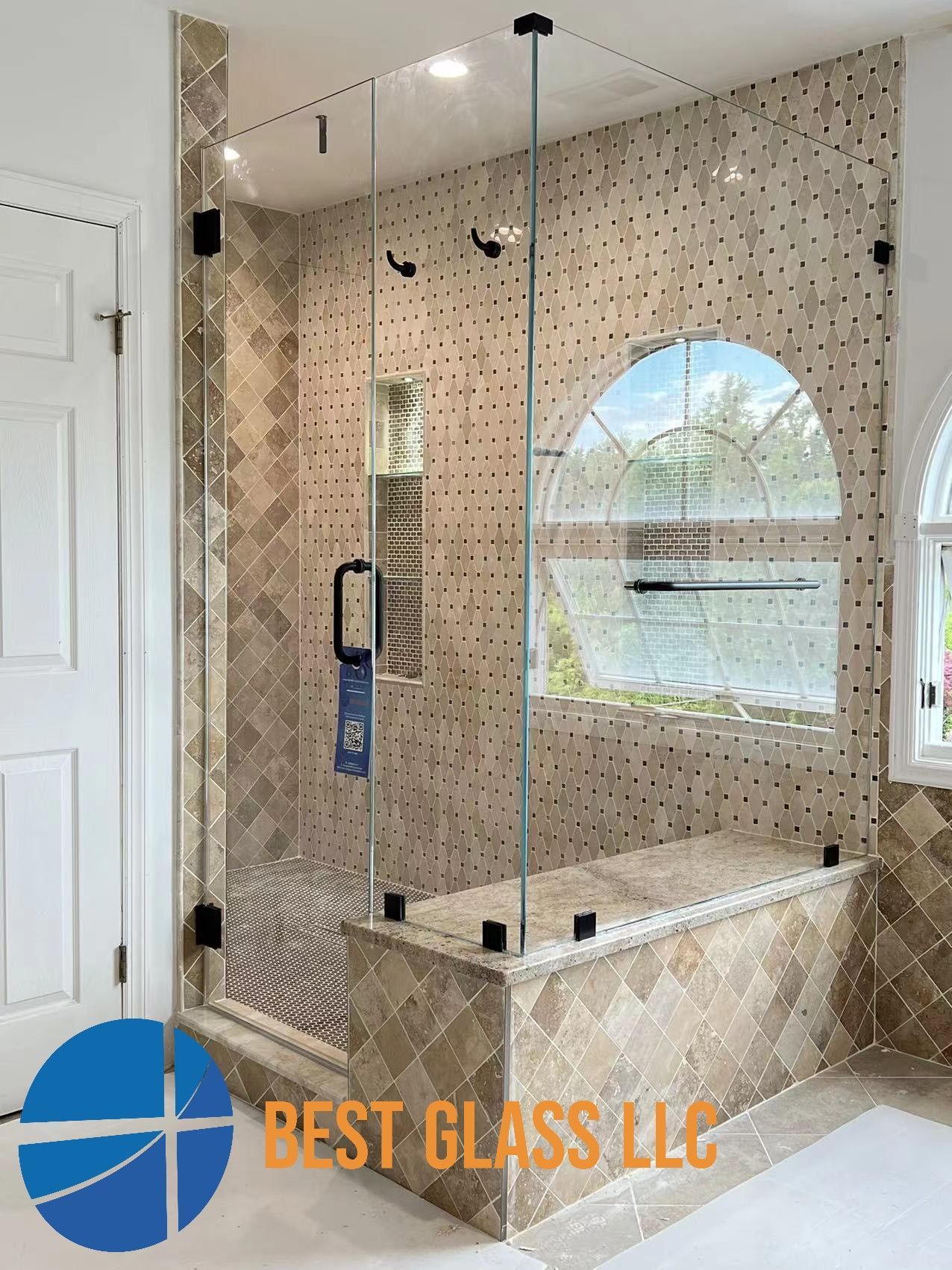 A bathroom with a walk in shower and a bathtub.