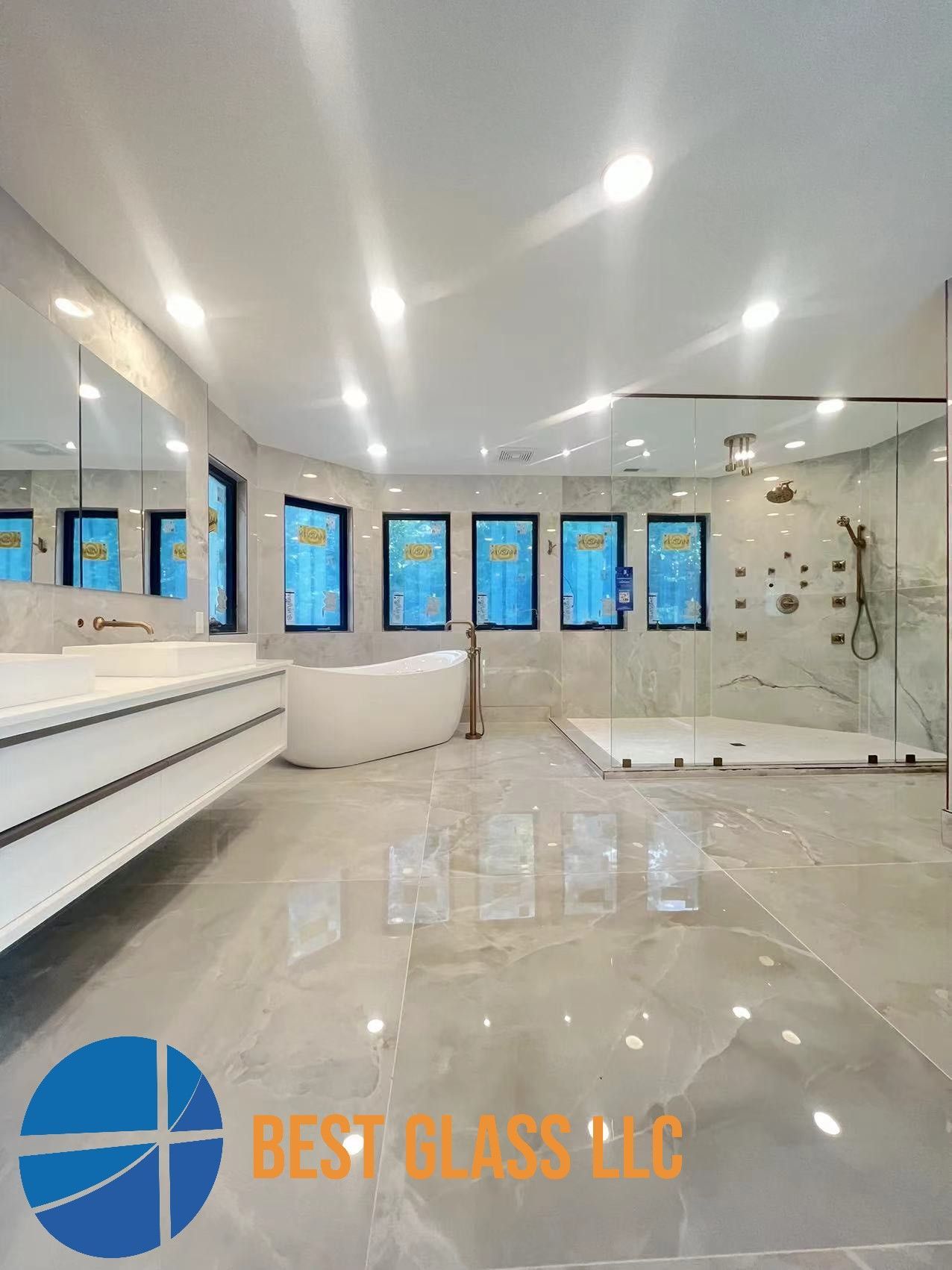 A bathroom with two sinks , a tub , and a walk in shower.